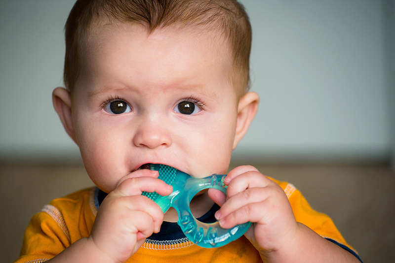 Baby Chewing on Teething Ring Toy Dental Care at Sweetwater Sugar Land TX