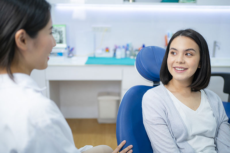 dentist talks to patient about dental fillings Dental Care at Sweetwater Sugar Land TX