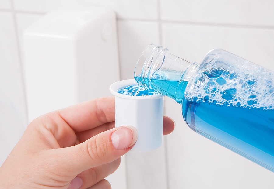 Closeup On Hand Holding Bottle Of Mouthwash