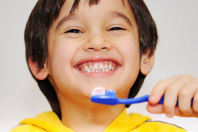 kid patient Dental Care at Sweetwater Sugar Land TX brushing teeth